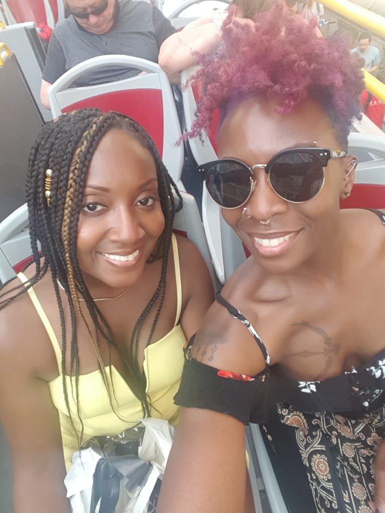 Two black sisters exploring London on the Red Double Decker Bus Tour