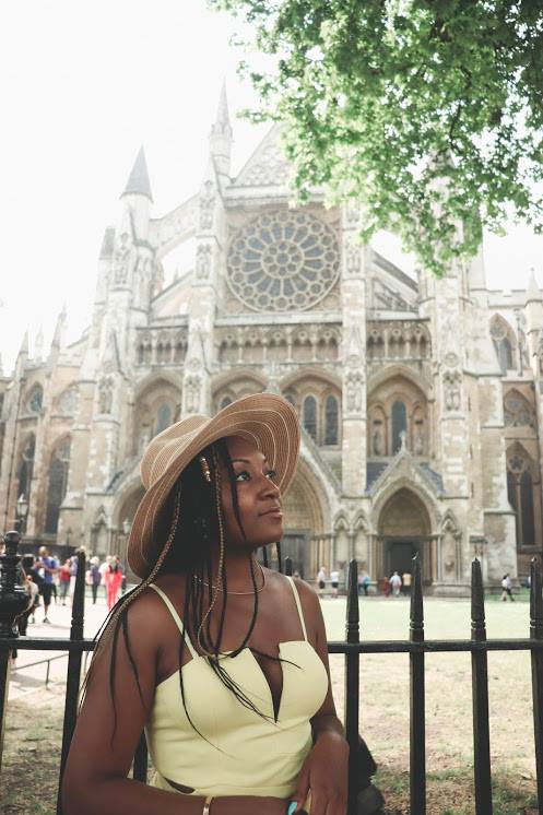 Black woman standing in front of Westminster Abbey