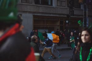 alt = "People Celebrating St. Patrick's Day in NY."