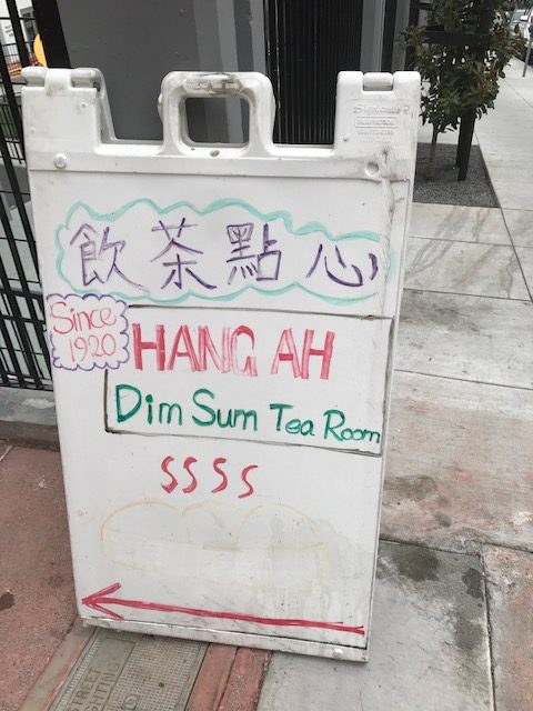 alt = "Hang Ah Tea Room Sign written in red and green".