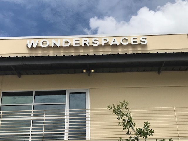alt = "Wonderspaces Austin Sign".