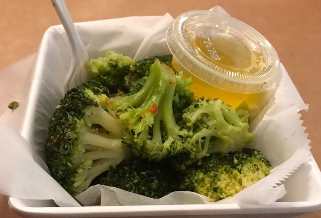 alt txt = "Close-up of broccoli at Locust Point Steamers restaurant in Baltimore’s Inner Harbor."
