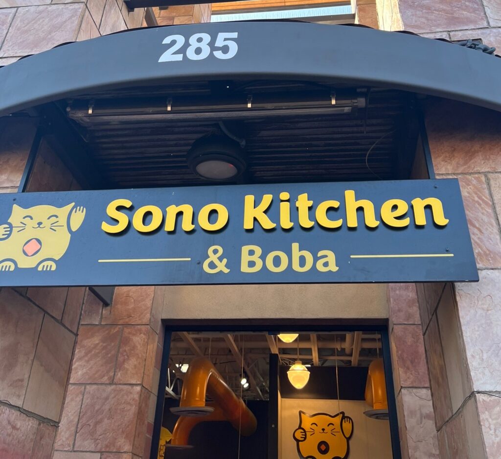 alt txt = "Sono Kitchen and Boba restaurant with yellow cat logo in Sedona."