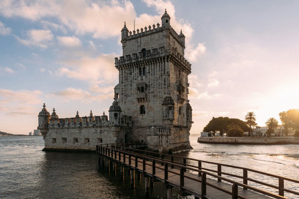 alt txt = "Large monument tower on a body of water".