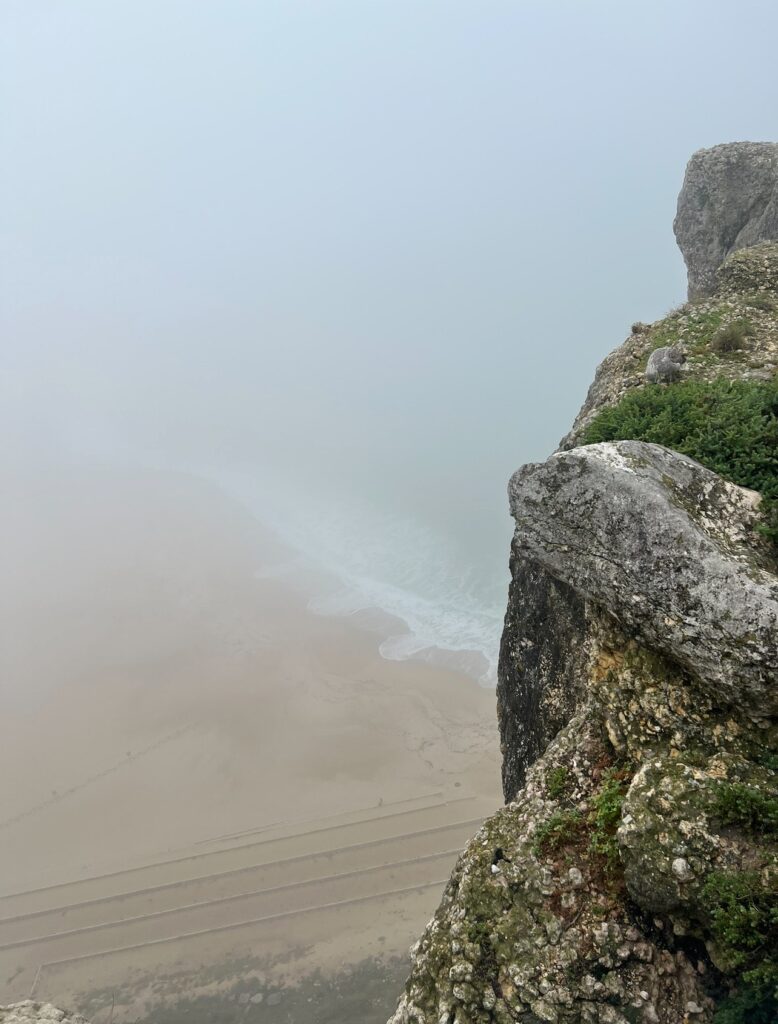 alt txt = "Cliffs on top of water".