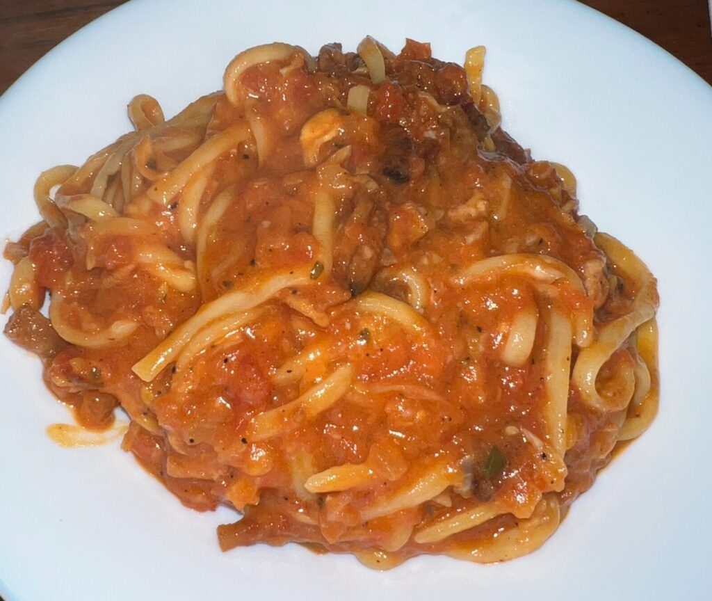 alt txt = "Pasta in a red sauce".