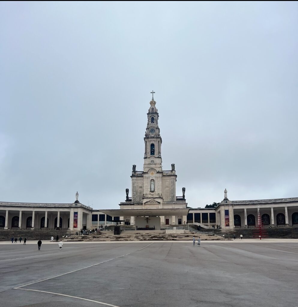 alt txt = "Concrete building under grey skies".
